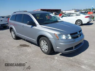 2018 Dodge Journey SE z VIN 3C4PDCAB8JT344720, wystawiony jako IAAI lot #40491703 z przebiegiem 86 601 mil mil oraz . Historia ofert i sprzedaży dostępna na DreamBid. Obrazek 1.