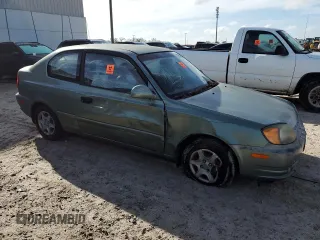 2005 Hyundai Accent GLS with VIN KMHCG35C75U328380, listed as a Copart auction lot 74935354 with 4,848 mi miles and Salvage Title. Bid and sale history available at carsss.com. Image 4.