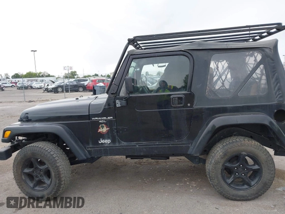 2000 Jeep Wrangler Sahara with VIN 1J4FA59S7YP805628, listed as a IAAI auction lot 42259201 with Not provided miles and . Bid and sale history available at DreamBid. Image 6.