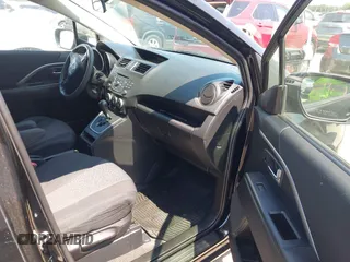 2012 Mazda 5 Sport z VIN JM1CW2BL0C0142657, wystawiony jako IAAI lot #42389495 z przebiegiem 107 790 mil mil oraz . Historia ofert i sprzedaży dostępna na DreamBid. Obrazek 5.
