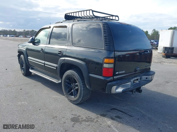 2004 Chevrolet Tahoe LT with VIN 1GNEC13ZX4J106072, listed as a IAAI auction lot 41703828 with 275,081 mi miles. Bid and sale history available at carsss.com. Image 3.