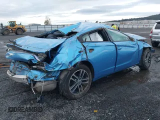 2019 Dodge Charger SXT with VIN 2C3CDXJG3KH577338, listed as a IAAI auction lot 40957322 with 65,457 mi miles and . Bid and sale history available at DreamBid. Image 4.