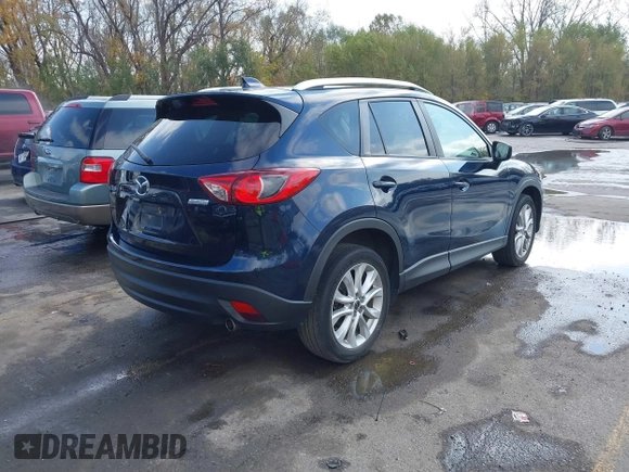 2015 Mazda CX-5 Grand Touring with VIN JM3KE4DY7F0478823, listed as a IAAI auction lot 40731626 with 82,884 mi miles. Bid and sale history available at carsss.com. Image 4.