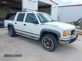 1994 GMC Suburban z VIN 1GKGK26N6RJ771534, wystawiony jako IAAI lot #42359227 z przebiegiem 257 865 mil mil oraz . Historia ofert i sprzedaży dostępna na DreamBid. Obrazek 1.