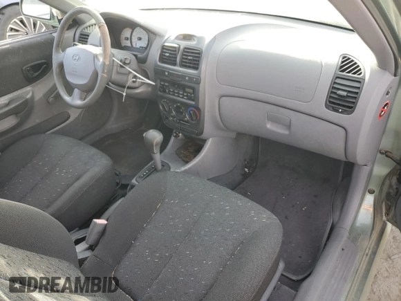 2003 Hyundai Accent GL with VIN KMHCG35CX3U242848, listed as a Copart auction lot 86558394 with 56,248 mi miles and Salvage Title. Bid and sale history available at carsss.com. Image 8.