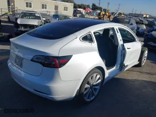 2018 Tesla Model 3 Long Range Battery with VIN 5YJ3E1EA6JF042844, listed as a IAAI auction lot 41349172 with 122,851 mi miles. Bid and sale history available at carsss.com. Image 4.