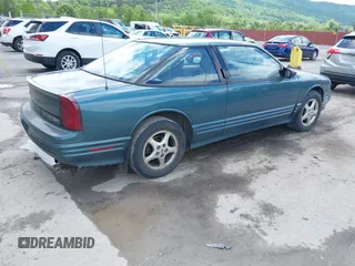 1997 Oldsmobile Cutlass Supreme S z VIN 1G3WH12M9VF317272, wystawiony jako IAAI lot #42346360 z przebiegiem 156 553 mil mil oraz . Historia ofert i sprzedaży dostępna na DreamBid. Obrazek 4.