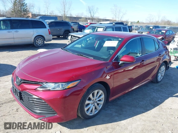 2019 Toyota Camry LE with VIN 4T1B11HK1KU233345, listed as a IAAI auction lot 41971136 with 51,499 mi miles and . Bid and sale history available at DreamBid. Image 2.