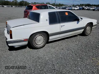 1990 Cadillac Eldorado z VIN 1G6EL1334LU616468, wystawiony jako Copart lot #76398934 z przebiegiem Nie podano mil oraz Szkody całkowita. Historia ofert i sprzedaży dostępna na DreamBid. Obrazek 3.
