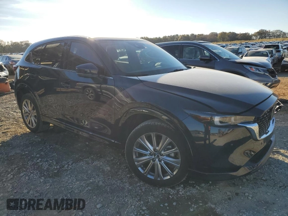 2023 Mazda CX-5 Signature with VIN JM3KFBXY1P0122544, listed as a Copart auction lot 83712034 with 27,032 mi miles and Salvage Title. Bid and sale history available at DreamBid. Image 4.