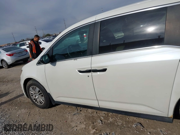 2014 Honda Odyssey LX with VIN 5FNRL5H24EB001551, listed as a IAAI auction lot 41879040 with 119,200 mi miles and . Bid and sale history available at DreamBid. Image 14.