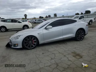2014 Tesla Model S 60 with VIN 5YJSA1H11EFP43395, listed as a Copart auction lot 54653845 with 120,180 mi miles and Salvage title. Bid and sale history available at DreamBid. Image 1.