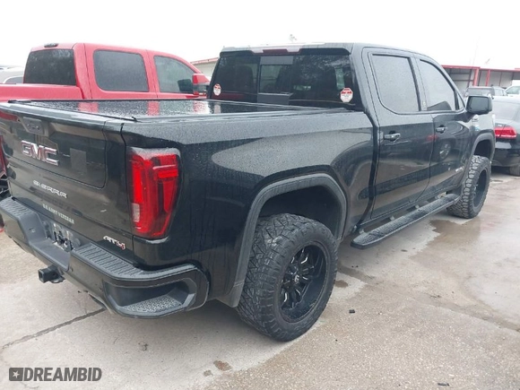 2019 GMC Sierra 1500 AT4 with VIN 1GTP9EEDXKZ144019, listed as a IAAI auction lot 41598034 with 106,046 mi miles. Bid and sale history available at carsss.com. Image 4.