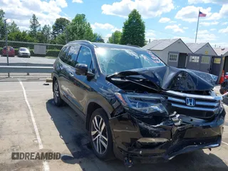 2017 Honda Pilot Touring z VIN 5FNYF5H91HB038268, wystawiony jako IAAI lot #42198597 z przebiegiem 62 195 mil mil oraz . Historia ofert i sprzedaży dostępna na DreamBid. Obrazek 1.