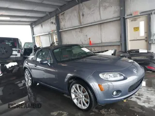 2006 Mazda MX-5 Miata Sport z VIN JM1NC25F560110444, wystawiony jako IAAI lot #42611844 z przebiegiem 58 309 mil mil oraz . Historia ofert i sprzedaży dostępna na DreamBid. Obrazek 1.
