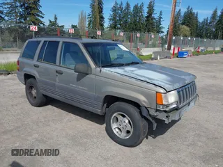 1997 Jeep Grand Cherokee Laredo with VIN 1J4GZ58S5VC500257, listed as a IAAI auction lot 41996034 with 222,513 mi miles and . Bid and sale history available at DreamBid. Image 1.