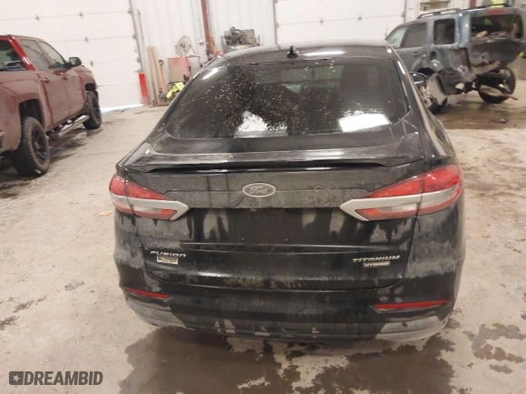 2020 Ford Fusion Hybrid Titanium with VIN 3FA6P0RU8LR141355, listed as a IAAI auction lot 41417807 with 61,288 mi miles. Bid and sale history available at carsss.com. Image 16.