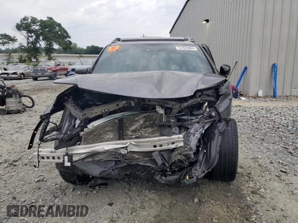 2021 Honda Passport Touring z VIN 5FNYF7H94MB005741, wystawiony jako Copart lot #57626664 z przebiegiem Nie podano mil oraz Szkoda całkowita • Salvage title. Historia ofert i sprzedaży dostępna na DreamBid. Obrazek 5.