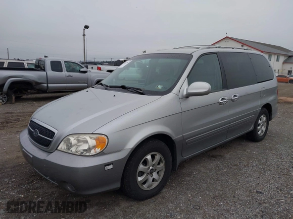 2004 Kia Sedona LX with VIN KNDUP131546535352, listed as a IAAI auction lot 41856784 with 128,943 mi miles. Bid and sale history available at carsss.com. Image 2.