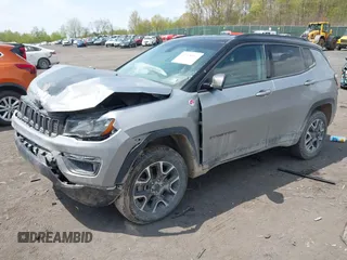 2020 Jeep Compass Trailhawk with VIN 3C4NJDDB4LT171685, listed as a IAAI auction lot 42168366 with 76,390 mi miles and . Bid and sale history available at DreamBid. Image 2.