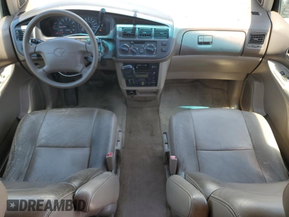 1998 Toyota Sienna LE with VIN 4T3ZF13C4WU064791, listed as a Copart auction lot 61411865 with 218,835 mi miles and Salvage title. Bid and sale history available at DreamBid. Image 8.