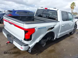 2023 Ford F-150 Lightning Pro with VIN 1FTVW1EV3PWG60491, listed as a IAAI auction lot 41507485 with 19,148 mi miles and . Bid and sale history available at DreamBid. Image 4.