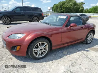 2011 Mazda MX-5 Miata Sport z VIN JM1NC2JF5B0218238, wystawiony jako Copart lot #56370185 z przebiegiem 92 336 mil mil oraz Szkoda całkowita • Salvage title. Historia ofert i sprzedaży dostępna na DreamBid. Obrazek 1.