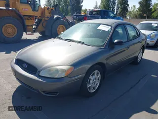 2005 Ford Taurus SE with VIN 1FAFP53U95A289971, listed as a IAAI auction lot 42143134 with 167,702 mi miles. Bid and sale history available at carsss.com. Image 6.