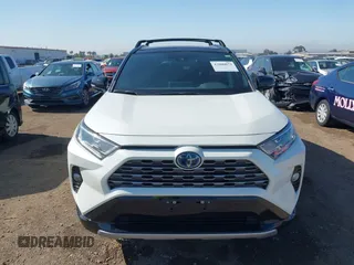 2021 Toyota RAV4 Hybrid XSE with VIN 4T3E6RFV3MU042773, listed as a IAAI auction lot 42000073 with 55,110 mi miles and . Bid and sale history available at DreamBid. Image 13.