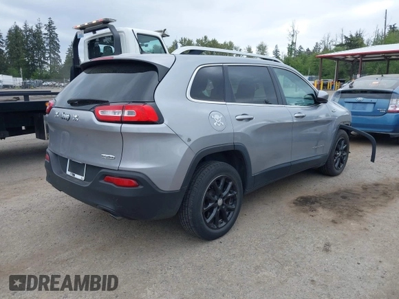 2014 Jeep Cherokee Latitude with VIN 1C4PJLCS1EW105984, listed as a IAAI auction lot 42242732 with 89,325 mi miles and . Bid and sale history available at DreamBid. Image 4.