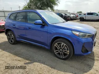 2024 BMW X1 xDrive28i with VIN WBX73EF06R5007063, listed as a Copart auction lot 56143075 with 2,947 mi miles and Salvage title. Bid and sale history available at DreamBid. Image 4.