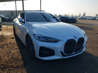 2021 BMW 4 Series 430i with VIN WBA53AP02MCG29966, listed as a IAAI auction lot 41013210 with Not provided miles and . Bid and sale history available at DreamBid. Image 1.