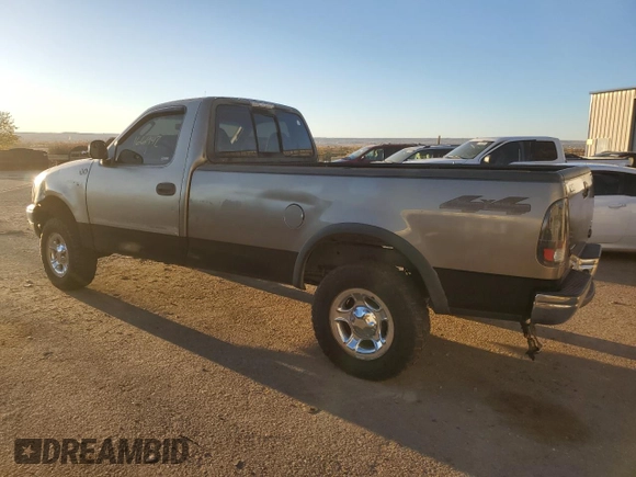 2002 Ford F-150 XL with VIN 1FTRF18262NB35586, listed as a Copart auction lot 77114114 with 166,942 mi miles and Salvage title. Bid and sale history available at DreamBid. Image 2.