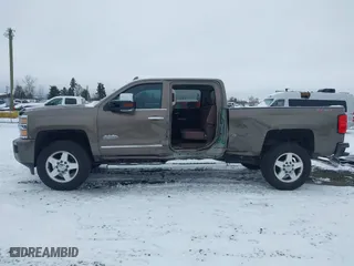 2015 Chevrolet Silverado 2500HD Built After Aug 14 High Country with VIN 1GC1KXE89FF543780, listed as a IAAI auction lot 41557608 with 164,171 mi miles. Bid and sale history available at carsss.com. Image 15.