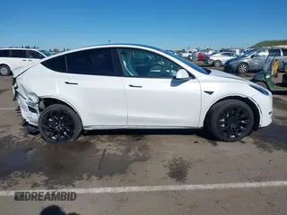 2023 Tesla Model Y Long Range with VIN 7SAYGDEE0PF945202, listed as a IAAI auction lot 41611762 with 7,316 mi miles and . Bid and sale history available at DreamBid. Image 13.