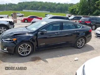 2019 Ford Fusion Titanium z VIN 3FA6P0RU0KR260239, wystawiony jako IAAI lot #42436643 z przebiegiem 114 631 mil mil oraz . Historia ofert i sprzedaży dostępna na DreamBid. Obrazek 14.