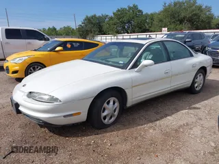 1996 Oldsmobile Aurora z VIN 1G3GR62C1T4121552, wystawiony jako IAAI lot #40766504 z przebiegiem 75 434 mil mil oraz . Historia ofert i sprzedaży dostępna na DreamBid. Obrazek 2.