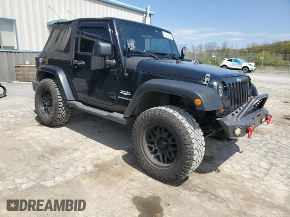 2011 Jeep Wrangler Sahara with VIN 1J4AA5D14BL542912, listed as a Copart auction lot 65158784 with 122,795 mi miles and Salvage Title. Bid and sale history available at DreamBid. Image 4.