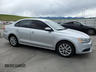 2014 Volkswagen Jetta SE with VIN 3VWD17AJ0EM314456, listed as a Copart auction lot 57380645 with 148,801 mi miles and Salvage title. Bid and sale history available at DreamBid. Image 4.