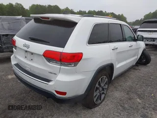 2018 Jeep Grand Cherokee Limited with VIN 1C4RJFBG8JC245999, listed as a IAAI auction lot 42345499 with 90,670 mi miles and . Bid and sale history available at DreamBid. Image 4.