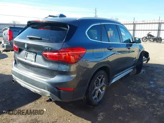 2017 BMW X1 sDrive28i with VIN WBXHU7C30H5H32753, listed as a IAAI auction lot 41441791 with 100,072 mi miles. Bid and sale history available at carsss.com. Image 4.