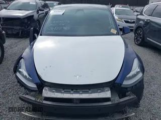 2021 Tesla Model Y Standard Range with VIN 5YJYGDED8MF122985, listed as a IAAI auction lot 41430423 with 120,302 mi miles and . Bid and sale history available at carsss.com. Image 6.