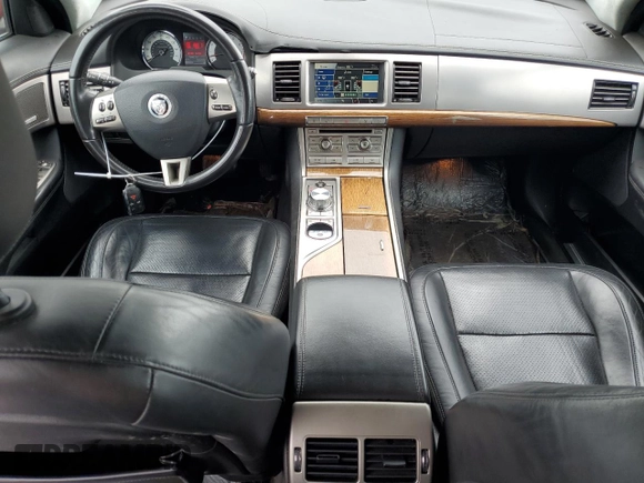 2010 Jaguar XF Supercharged with VIN SAJWA0HE1AMR74203, listed as a Copart auction lot 64029824 with 128,676 mi miles and Salvage Title. Bid and sale history available at carsss.com. Image 8.