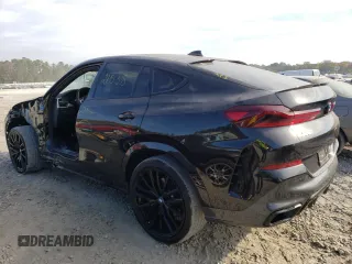 2022 BMW X6 xDrive40i z VIN 5UXCY6C08N9L22942, wystawiony jako Copart lot #64176732 z przebiegiem 21 538 mil mil oraz . Historia ofert i sprzedaży dostępna na DreamBid. Obrazek 3.
