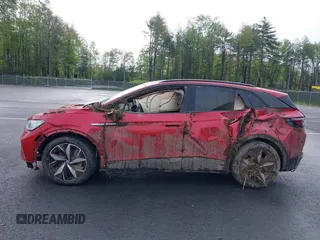 2023 Volkswagen ID.4 Pro S z VIN 1V2FMPE83PC010566, wystawiony jako IAAI lot #42255980 z przebiegiem Nie podano mil oraz . Historia ofert i sprzedaży dostępna na DreamBid. Obrazek 14.