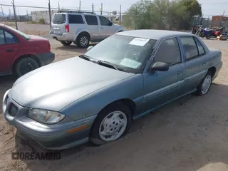 1996 Pontiac Grand Am SE with VIN 1G2NE52M8TC810732, listed as a IAAI auction lot 42338979 with 107,027 mi miles and . Bid and sale history available at DreamBid. Image 2.