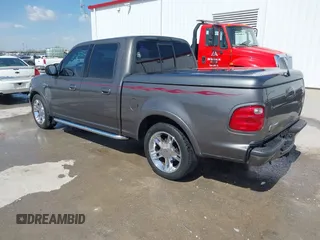 2002 Ford F-150 Harley Davidson with VIN 1FTRW07392KE11409, listed as a IAAI auction lot 41877998 with 148,476 mi miles. Bid and sale history available at carsss.com. Image 3.