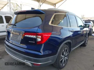 2019 Honda Pilot Touring 8-Passenger z VIN 5FNYF5H97KB013530, wystawiony jako IAAI lot #42403449 z przebiegiem 90 557 mil mil oraz . Historia ofert i sprzedaży dostępna na DreamBid. Obrazek 4.