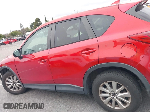 2016 Mazda CX-5 Touring with VIN JM3KE2CY3G0877185, listed as a IAAI auction lot 41729243 with 144,656 mi miles. Bid and sale history available at carsss.com. Image 14.