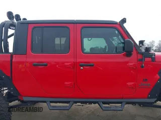 2020 Jeep Gladiator Rubicon with VIN 1C6JJTBG4LL178260, listed as a IAAI auction lot 42602460 with 61,899 mi miles and . Bid and sale history available at DreamBid. Image 13.